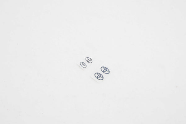 Logo plate decals for FCX18 Land Cruiser 80 in multiple sizes.